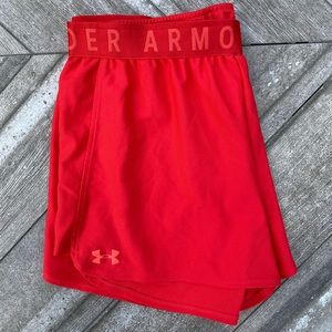 Under Armour heat gear size L shorts, loose fit, bright orange-red color
